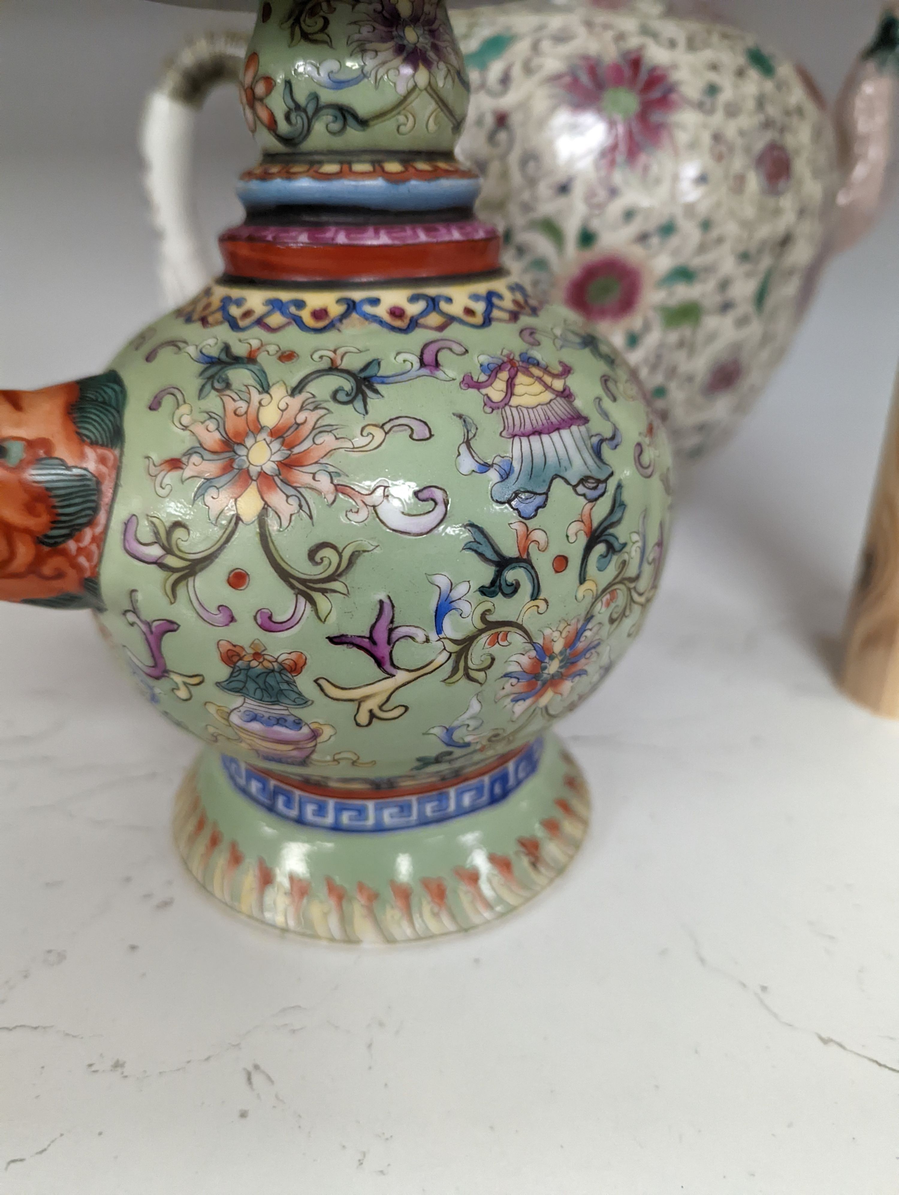 A large 19th century Chinese famille rose wine pot, and another wine pot, tallest 27cm